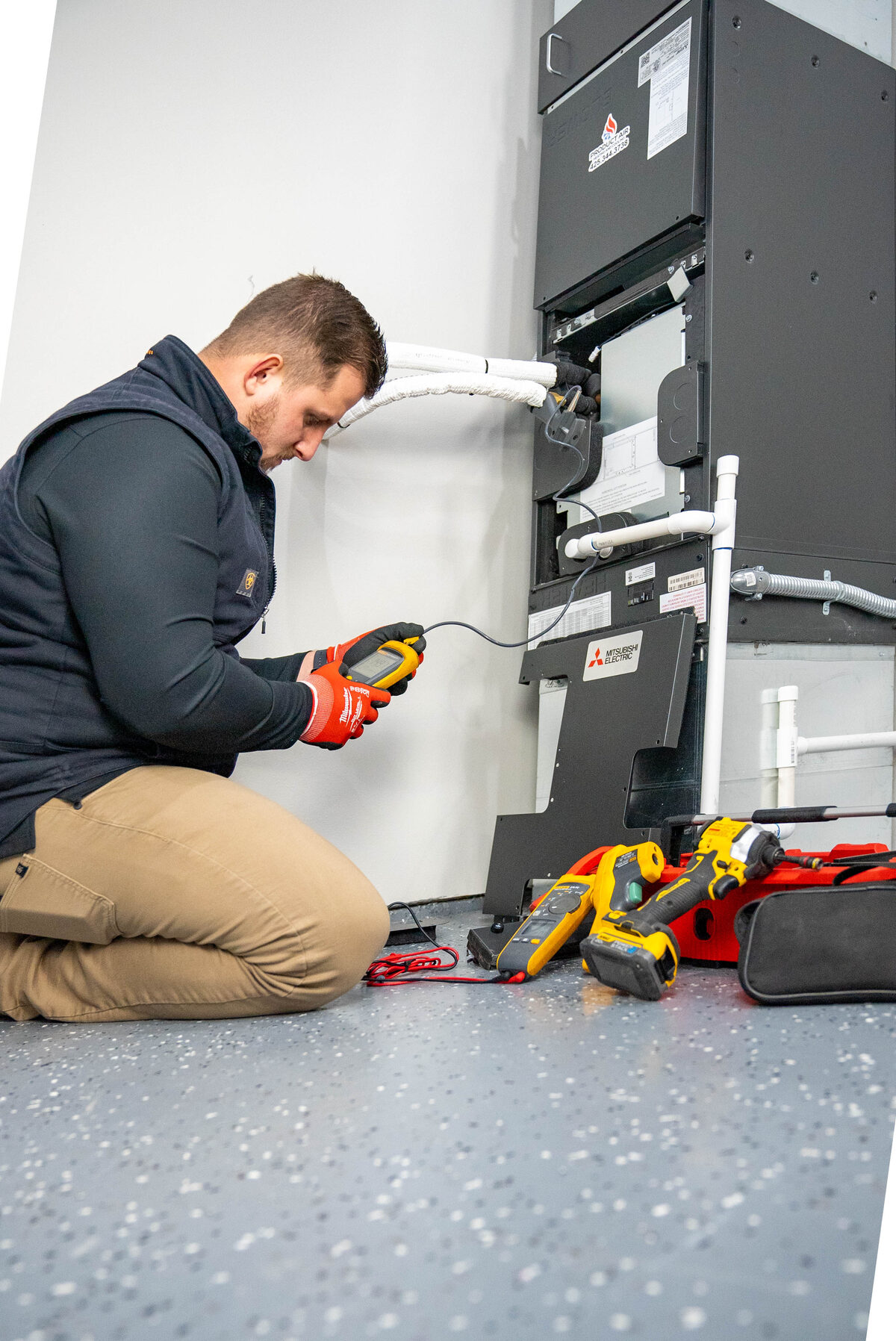 Product Air technician working on a Mitsubishi indoor air handler